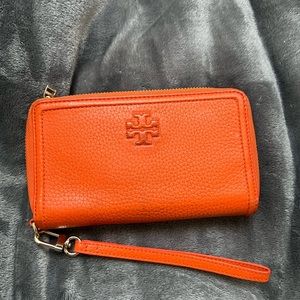 tory burch burnt orange wristlet card slot wallet zipper closure